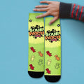 Flat lay product shot of Sour Patch Kids socks against a light blue background. [lf]