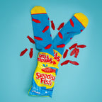 Flatlay product shot of Swedish Fish socks and a bag of Swedish Fish candy on a light blue background. [lf]