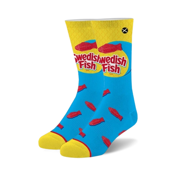 blue crew socks with a pattern of red swedish fish candy. yellow toes and heels. for men and women.  