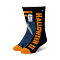 A pair of black crew socks with an orange 'Halloween II' graphic and Michael Myers wielding a knife.