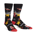 Pair of black crew socks with a retro alien abduction design.  Features red accents, yellow stars, and illustrations of robots and UFOs.