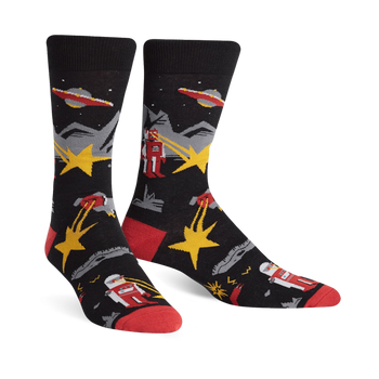 black crew socks with sci-fi theme. red and yellow stars, grey and red robots shooting lasers, flying saucers.   