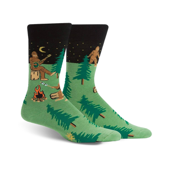 mens green black toe heel crew socks with cartoon bigfoot camping pattern.  