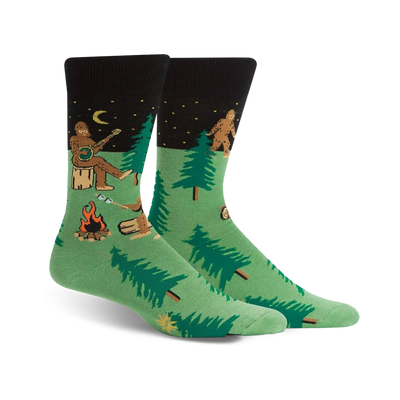 mens green black toe heel crew socks with cartoon bigfoot camping pattern.  