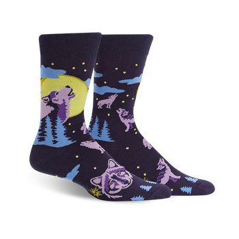 dark blue crew socks feature howling purple wolves and pine trees illuminated by a full moon. fall-themed design for men.  