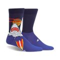 Pair of navy blue crew socks featuring a graphic of a shark emerging from water with a retro surfboard design and 'Totally Jawsome!' text.
