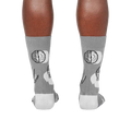 Rear view of the socks highlighting the brains on the heels.  The gray and white color scheme is clearly visible.