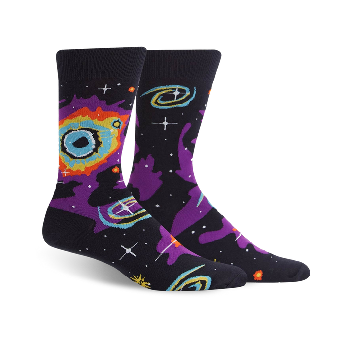 ribbed cuff, reinforced toe and heel, black crew socks, with purple and blue galaxy, stars, and planets pattern.    }}
