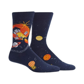 A pair of navy blue crew socks with a space-themed design.  The design includes a rocket ship, planets in orange and yellow, and stars on a dark blue background.