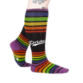 Lifestyle shot of a person wearing the rainbow striped knee-high socks.