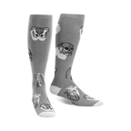 Pair of gray knee-high socks with a whimsical anatomical design. Features skulls, ribcages, and hearts in grayscale.