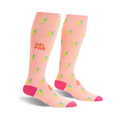 Pair of peach-pink knee-high socks with a scattered yellow and teal lightning bolt pattern and 'GRL PWR' text.