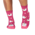 Lifestyle photo showing the 'Look At Me Meow' socks on a person's feet.
