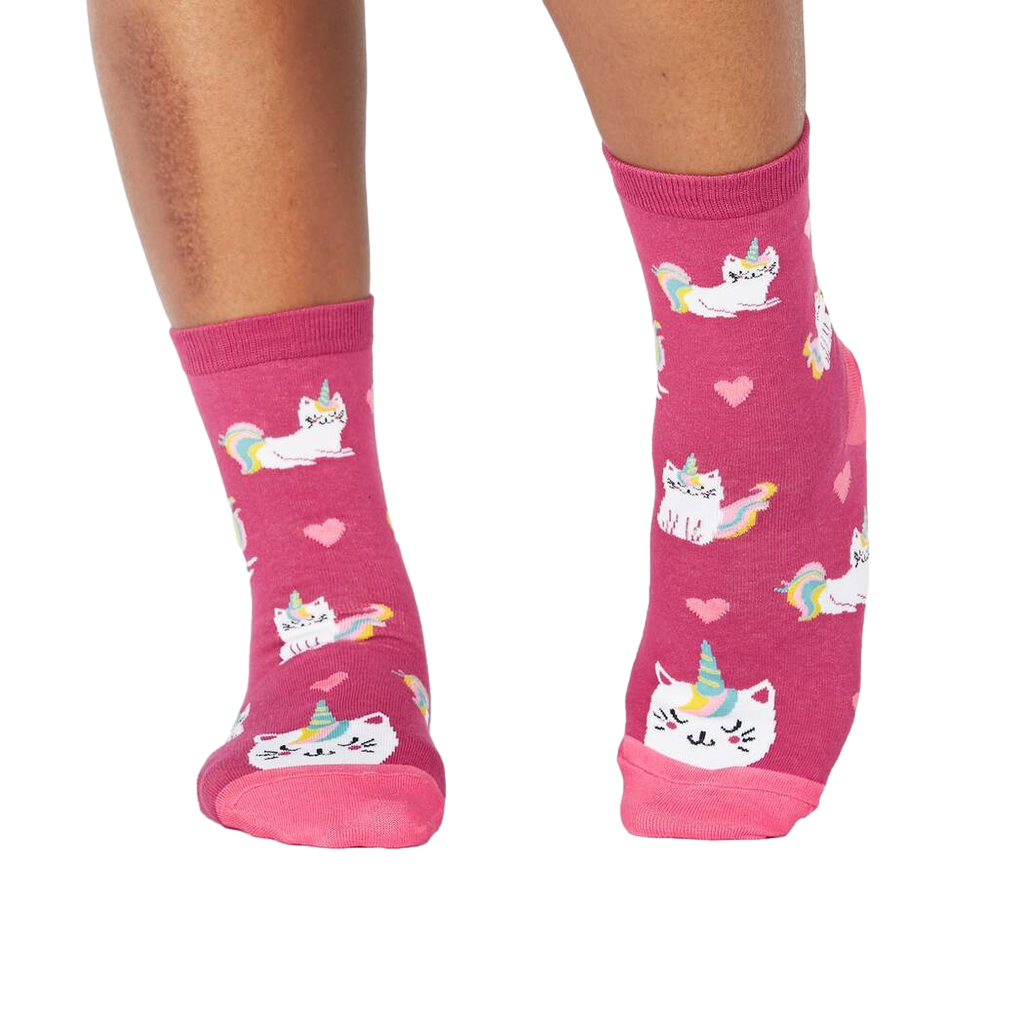 Lifestyle photo showing the 'Look At Me Meow' socks on a person's feet.