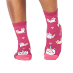 Lifestyle photo showing the 'Look At Me Meow' socks on a person's feet.