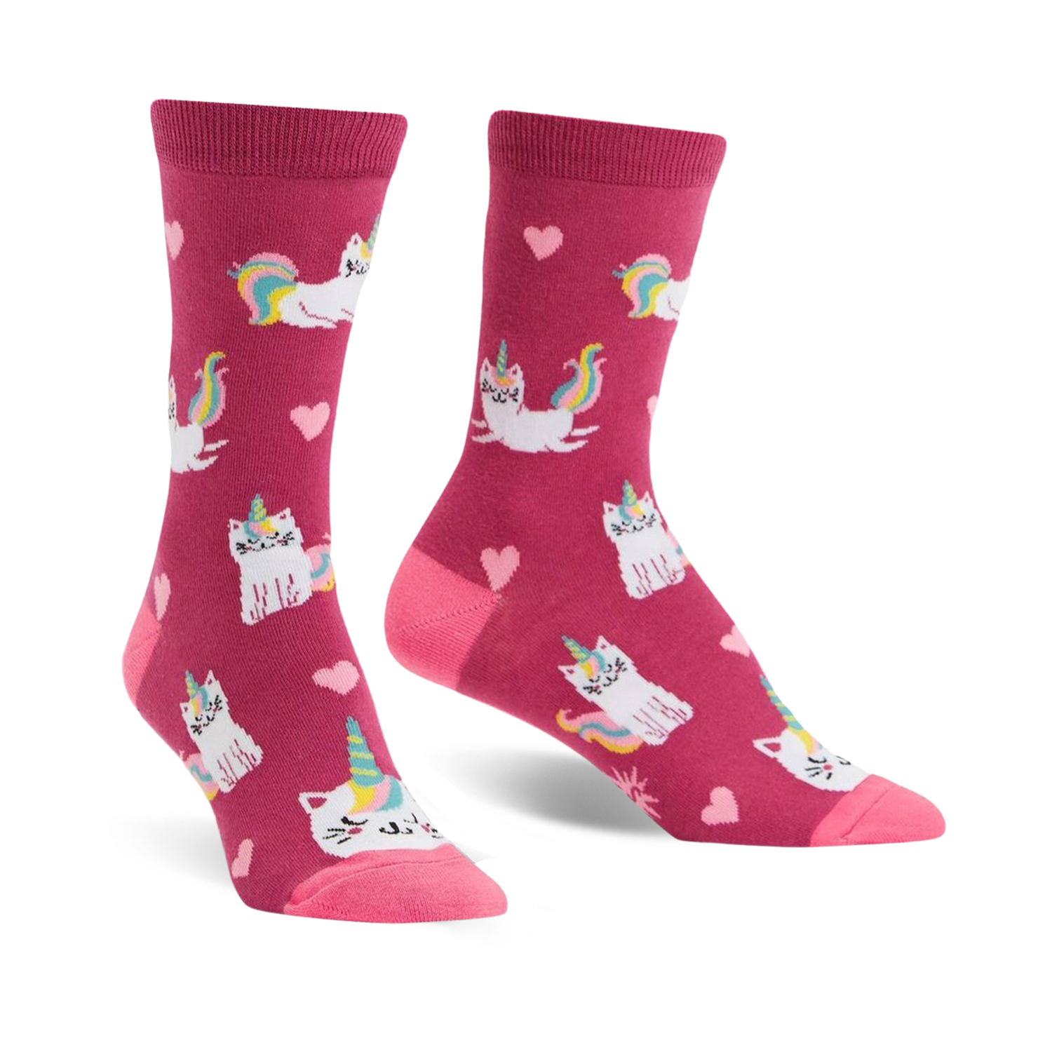 Crew socks in pink featuring a pattern of white cats with unicorn horns and rainbow tails, and pink hearts.