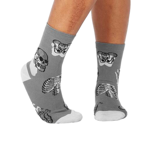 Lifestyle shot of Head Over Heel socks on a person's legs, showcasing the anatomical design and fit.
