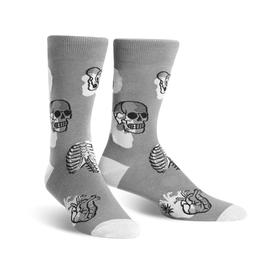 gray crew socks with black and white skulls, rib cages, and hearts pattern. womens size.   