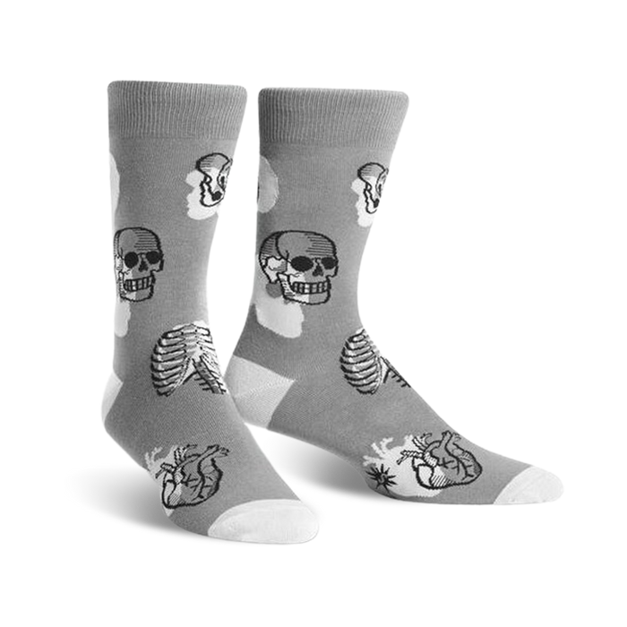 gray crew socks with black and white skulls, rib cages, and hearts pattern. womens size.   