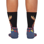 Back view of the 'All Bundled Up' socks on a model.  Shows the full moose design and snowflake pattern on the back of the socks.