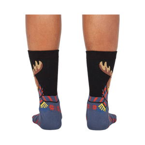 Back view of the 'All Bundled Up' socks on a model.  Shows the full moose design and snowflake pattern on the back of the socks.