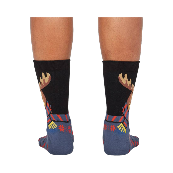 Back view of the 'All Bundled Up' socks on a model.  Shows the full moose design and snowflake pattern on the back of the socks.