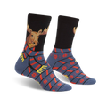 A pair of crew socks showcasing a moose wearing a scarf. The socks are predominantly black and blue with red and yellow accents. A snowflake pattern adorns the lower portion.