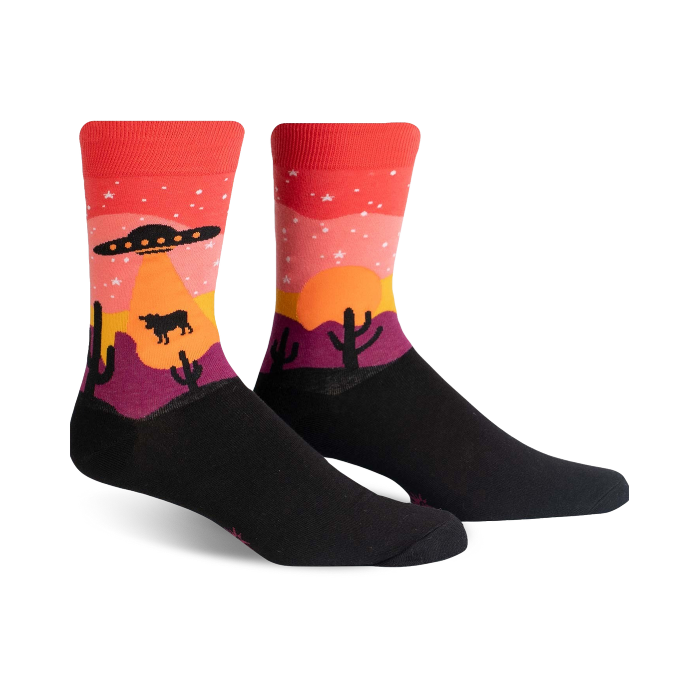 Crew socks in black, red, orange, and purple, featuring a desert sunset scene with a UFO, stars, cacti, and a cow.