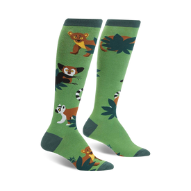 green knee-high women's socks featuring playful cartoon lemurs and fossa.  