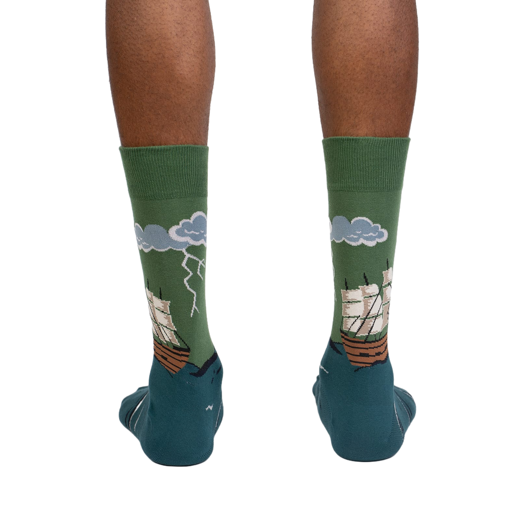 Rear view of the socks on a person's feet. Shows the back of the sock design.