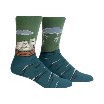 Pair of teal and green crew socks.  Design features a sailing ship encountering stormy seas and lightning.
