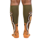 Rear view of a person wearing a pair of Meerkat Manner knee-high socks, showing the full meerkat design on both socks.