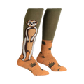 Pair of knee-high socks; olive green and orange; meerkat illustration; sandy background with small green plants.