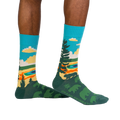 Lifestyle shot of model wearing Grand Prismatic socks, showcasing the design and fit.
