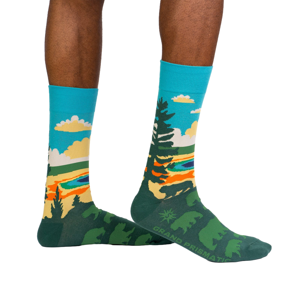 Lifestyle shot of model wearing Grand Prismatic socks, showcasing the design and fit.