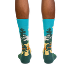 Rear view of model wearing Grand Prismatic socks, highlighting the full sock design.