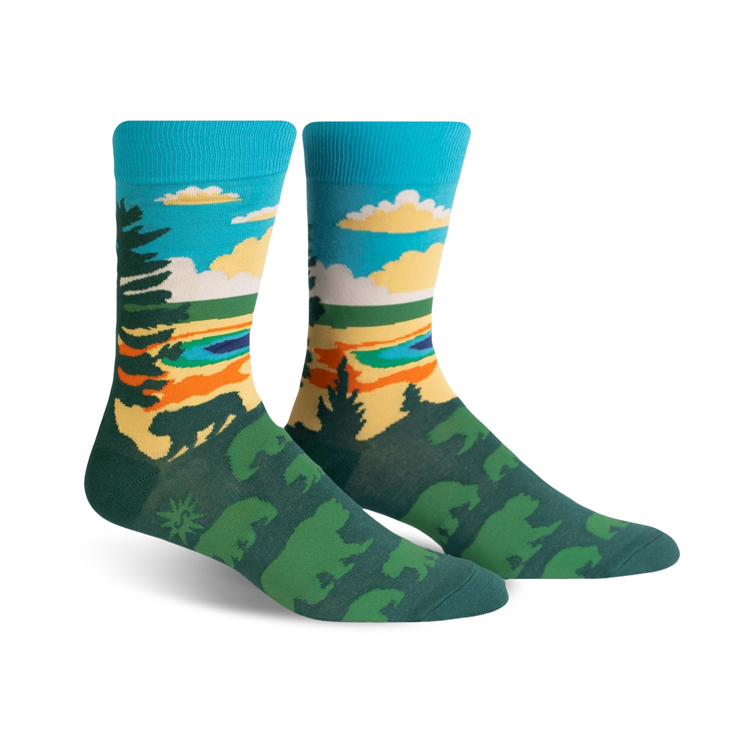 Pair of crew socks showcasing a nature scene. Teal, green, and orange colors depict trees, a lake, and sky. Fun, artistic design.