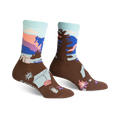 Brown crew socks with a Glacier National Park design.  Features a mountain scene, trees, and camping gear in blues, pinks, and purples.