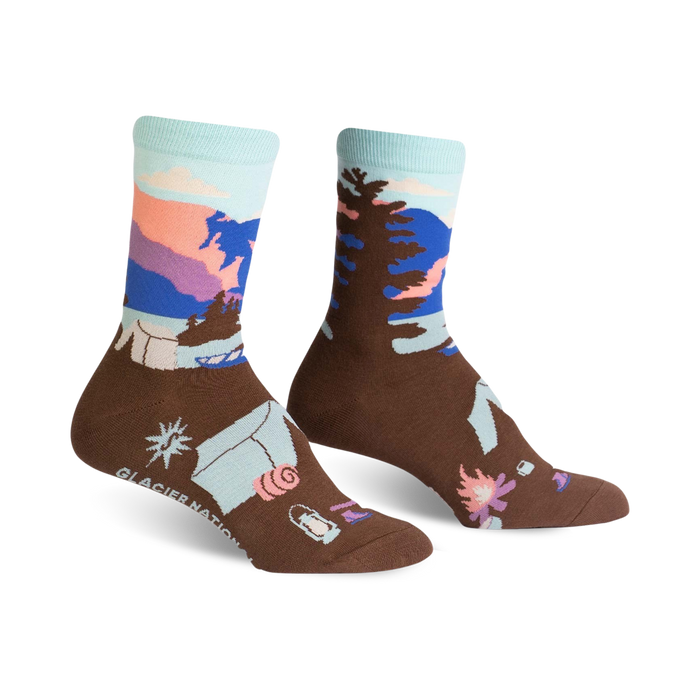  glacier national park hiking socks for women are brown with a blue and purple mountain design.   }}
