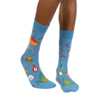 Lifestyle photo showing the 'Grillin' It' socks on a person's legs against a white background.