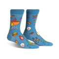 A pair of light blue crew socks with a fun BBQ design featuring burgers, hot dogs, grilling equipment, and chef hats.