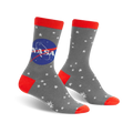 Gray crew socks with a vibrant red cuff, the NASA logo, and a white star pattern. Glow-in-the-dark design.