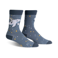 Pair of crew socks in blue and white. Design features an astronaut riding a whale amidst stars and sparkles.