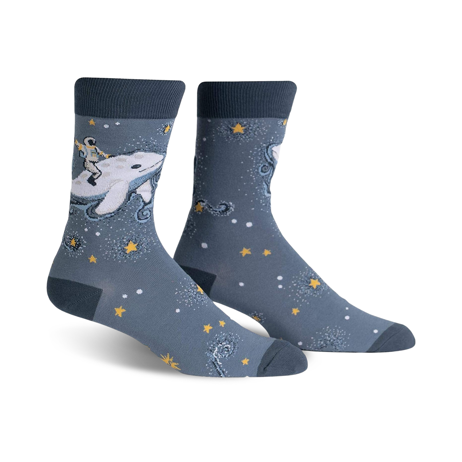 Pair of crew socks in blue and white. Design features an astronaut riding a whale amidst stars and sparkles.