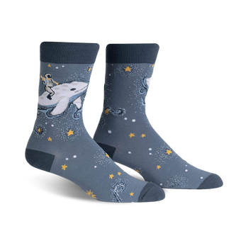 blue crew socks with astronaut riding narwhal in space. mens cosmic theme socks.  