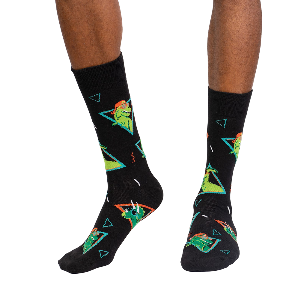 Lifestyle shot of a person modeling the Jurassic Party socks, showing the socks on their feet.