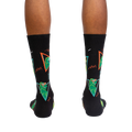 Back view of the Jurassic Party socks on a person's feet.