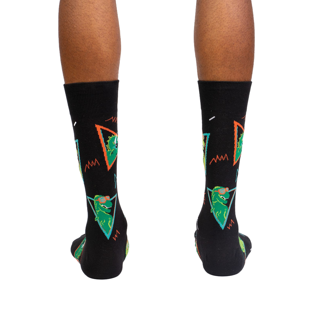 Back view of the Jurassic Party socks on a person's feet.