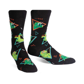 black crew socks feature geometric pattern with green dinosaurs wearing sunglasses and pink hats.  