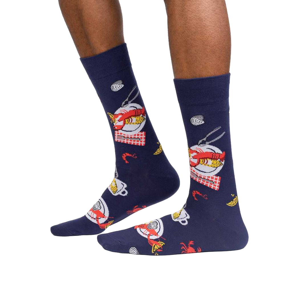 Lifestyle shot showcasing the 'Get Crackin!' socks on a person's feet, highlighting how they look when worn.